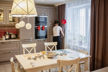 Woman cleaning in a beautiful bright kitchen