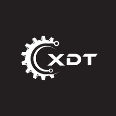 Obraz premium XDT letter technology logo design on black background. XDT creative initials letter IT logo concept. XDT setting shape design. 