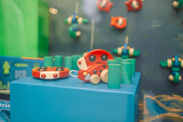 Color various wooden toys as a gift, eco-friendly and safe handmade products for children development and learning in window store 