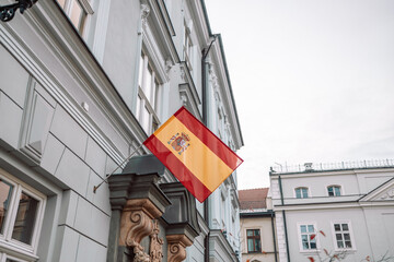 Close up shot of a Spanish flag on a building of administrative or government or consulate building