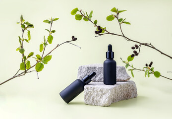 bottles for cosmetics on the podium made of stone and alder branches with leaves and cones on a...