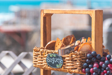 Sunny event at beach salon with cheese board and italian food on table with pasta
