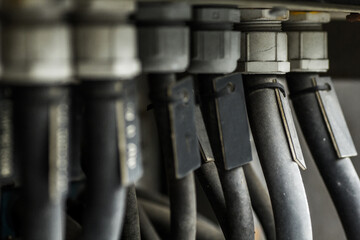 Powerful black cables connecting the electric vehicle engine, inverter, traction battery and air...