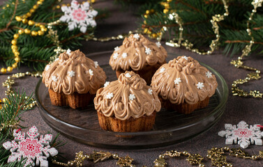 Festive homemade cupcakes with condensed milk cream on brown table, Close up