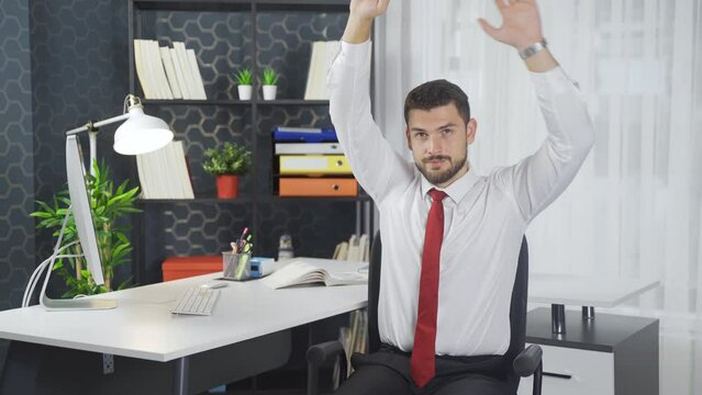 Exercises that can be done in the office. Stretching exercises.
Office worker showing exercises that can be done in the office.
