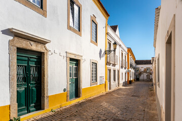 Portugal, August 2022: Street and traditional houses in the city of Faro, Algarve, Portugal