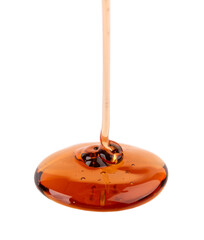 Caramel syrup drizzle isolated on white background. Splashes of sweet caramel sauce.