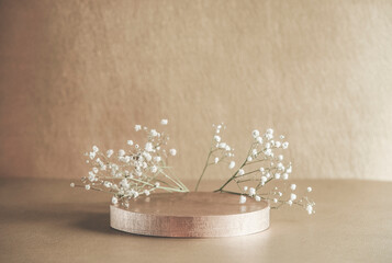Beige product display with podium and little white gypsophila flowers. Scene stage showcase. Front...