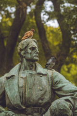 Pidgeons on a statue isolated