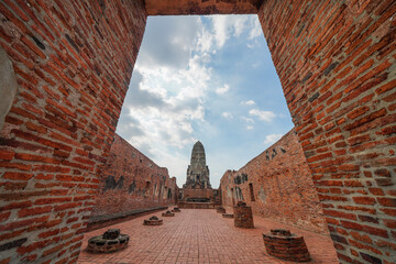 Ruins of pagodas, monks and walls of Wat Ratchaburana, Ayutthaya, Thailand that were destroyed by...