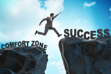 Businessman jumping over cliff in the concept