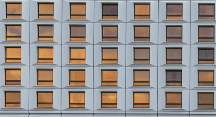 Geometric window building as abstract texture. Building windows pattern background.
