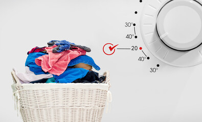 Concept cold washing laundry. basket with dirty laundry. Clothes in rattan basket. dirty laundry...