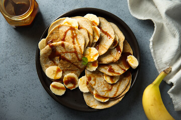 Homemade banana pancakes with caramel sauce