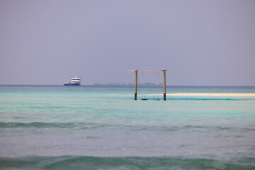 Swing with Beautiful Sun Sea Sand and Sky in Maldive, luxury tropical resort, turquoise transparent sea a, summer time, Nature Background