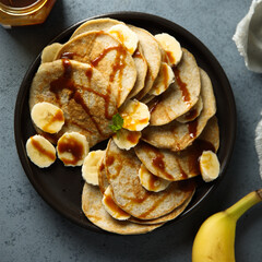 Homemade banana pancakes with caramel sauce