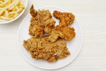 Close up of fried chicken and french fries