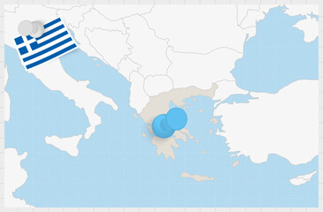 Obraz premium Map of Greece with a pinned blue pin. Pinned flag of Greece.