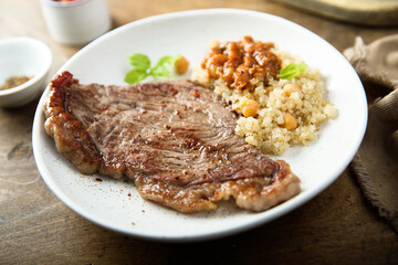 Beef steak with chickpea and vegetable sauce