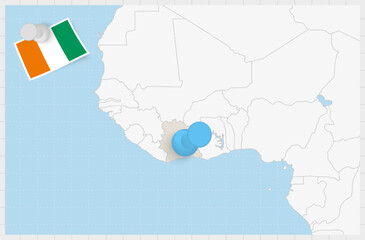 Map of Ivory Coast with a pinned blue pin. Pinned flag of Ivory Coast.