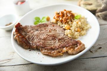 Beef steak with chickpea and vegetable sauce