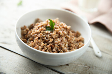 Traditional homemade buckwheat porridge in a white bowl