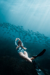 underwater girl who dive in deep ocean with fish 02