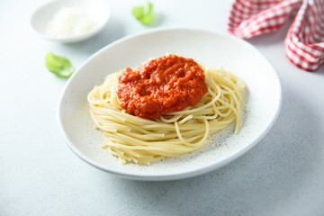 Spaghetti with tomato sauce and basil