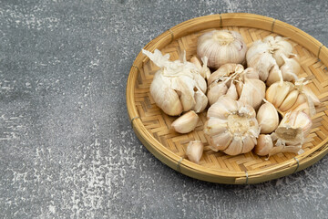 Fresh raw garlic on dark background for cooking concept set up