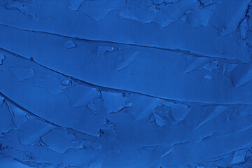 Navy blue smeared plaster. Abstract indigo color texture. Dark textured background