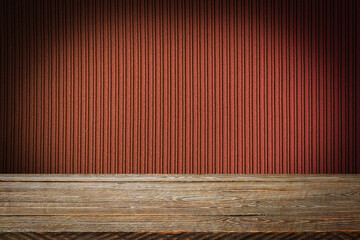 The background is blank wooden boards and a textured striped wall with gradient lighting and vignetting.