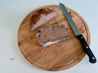 Banknotes between two slices of bread represent exploding inflation and the associated rising...