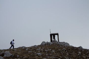 hiker on monte mutria in the Matese park with a religious chapel