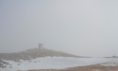 hiker on monte mutria in the Matese park with a religious chapel