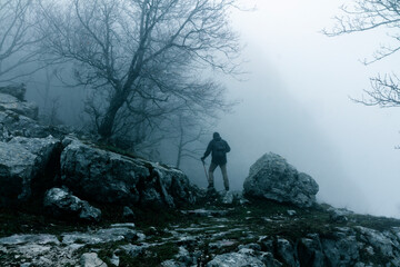 hiker in the fog on alburni mountains