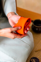 Japanese woman tea master, Sen Rikyu, hands preparing purifying cloth for Japanese traditional tea ceremony © A Certain Aesthetic