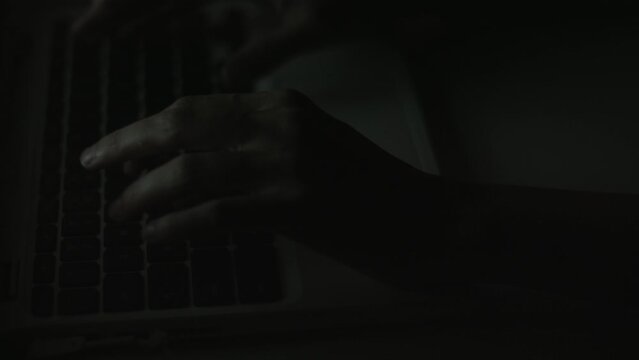 Young Woman's Hands Typing On Laptop Late at Night 4K