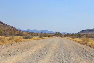 Fototapeta na wymiar Namibian landscape along the gravel road. Khomas, Namibia.