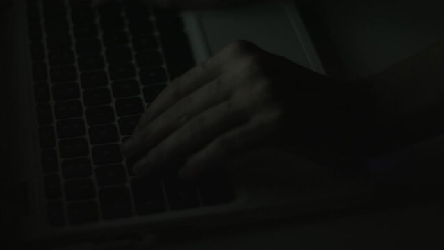 Young Woman's Hands Typing On Laptop Late at Night 4K
