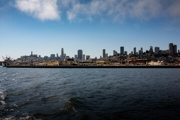 Fototapeta na wymiar Skyline of San Franciso, California, from the Sea with Skykrapers and harbour