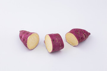 A sweet potato placed on a white background.