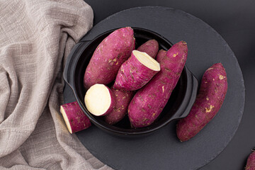 A sweet potato placed on a white background.