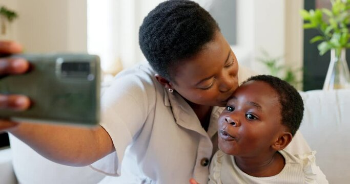 Selfie, mother and girl with phone, kiss and hug in living room on sofa smile, together and happiness on smartphone. Happy black woman and kid love internet, online and social media picture in home