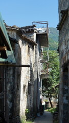 The beautiful traditional Chinese village view with the classical architecture and fresh green trees as background