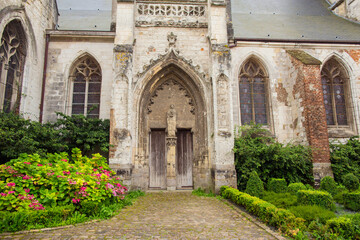 Fototapeta na wymiar Entrance to the church of Saint Saulve church, Montreuil Sur Mer, France