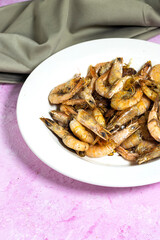 Delicious roasted grilled shrimps on plate