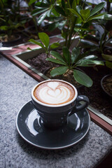 Latte served on the table at the outdoor seating