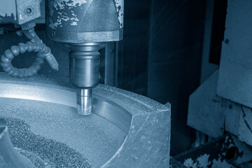 The CNC milling machine rough cutting the cast iron material.