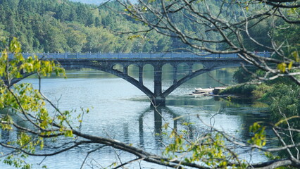 The old arched stone bridge view located in the countryside of the China