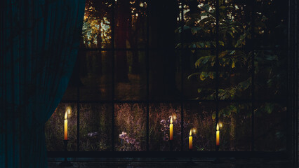 Old window with a curtain and burning candles in a forest house.